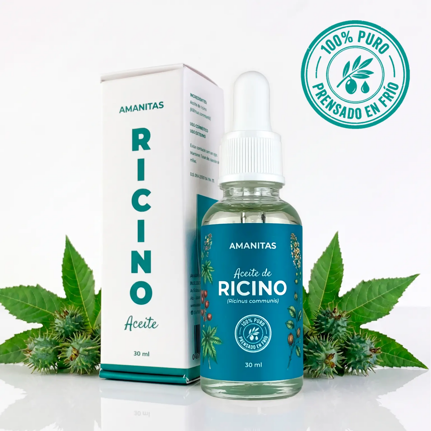 Caja y frasco de 30 ml del Aceite de Ricino puro de la marca Amanitas, rodeado de hojas y semillas de la planta de ricino. Producto 100% natural y extraído por prensado en frío para uso cosmético.