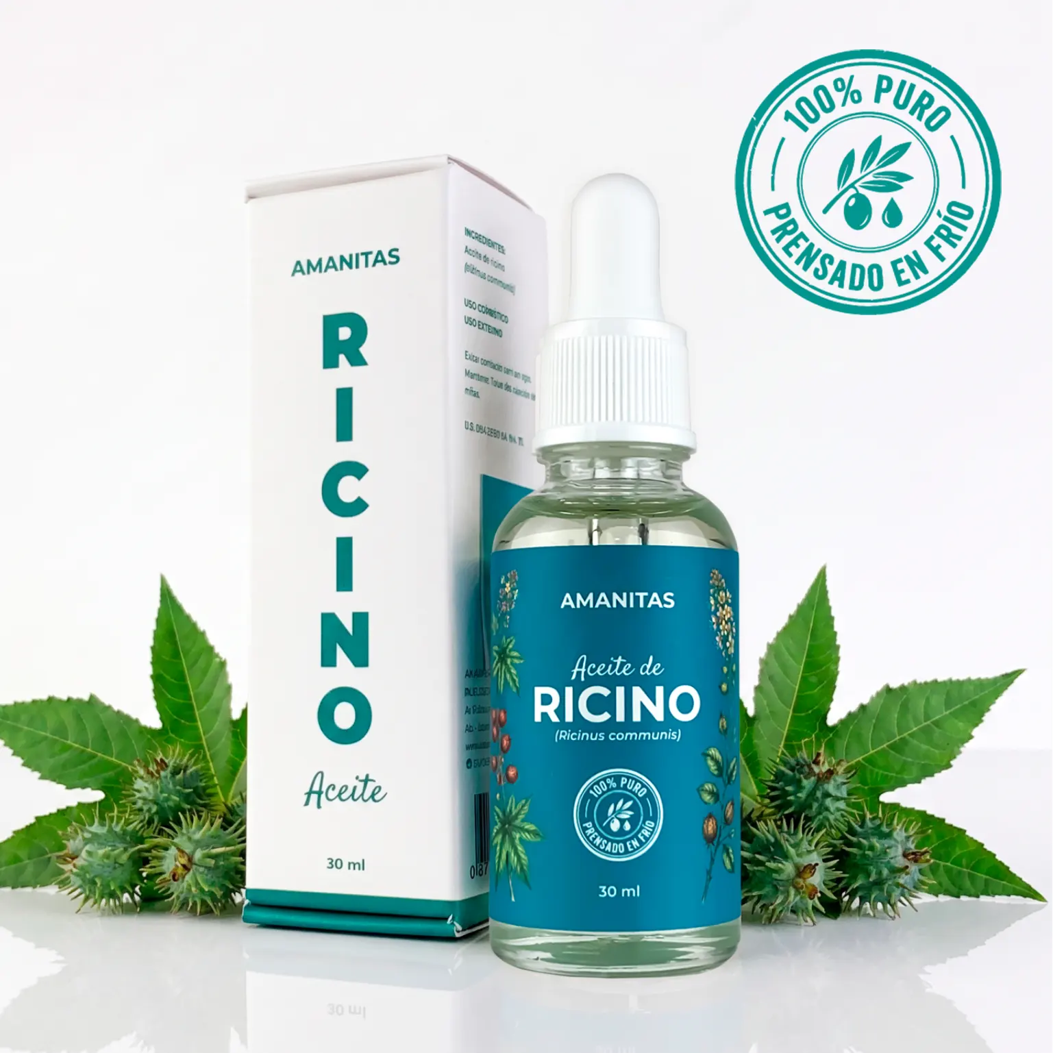 Caja y frasco de 30 ml del Aceite de Ricino puro de la marca Amanitas, rodeado de hojas y semillas de la planta de ricino. Producto 100% natural y extraído por prensado en frío para uso cosmético.