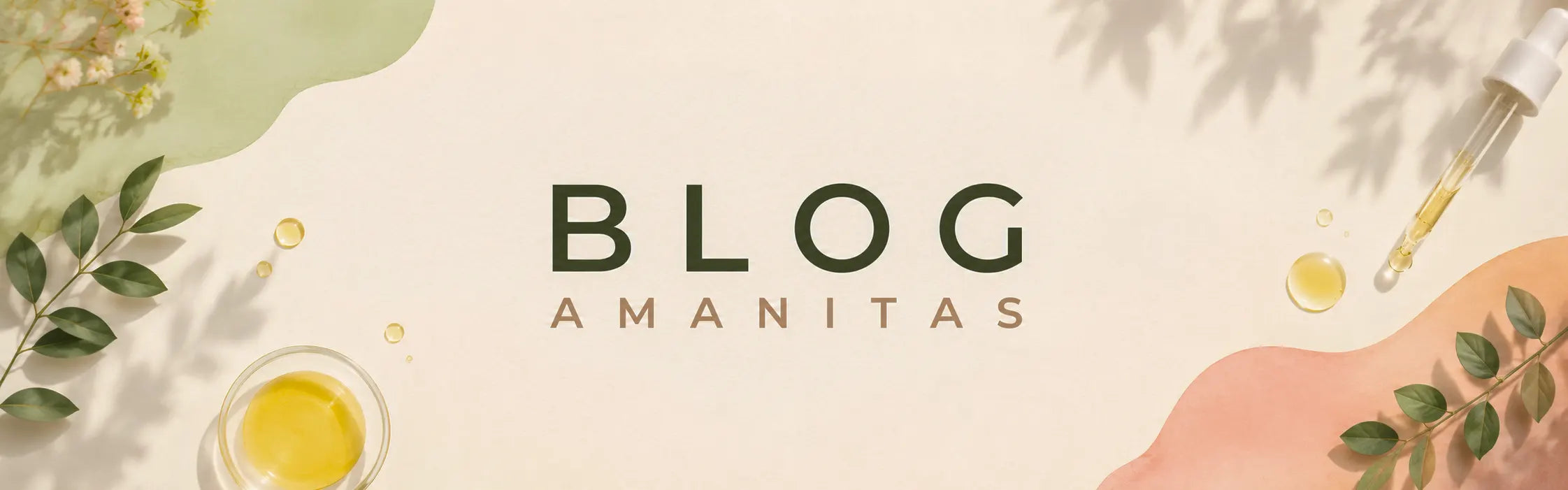 Banner principal del Blog Amanitas con texto "BLOG" (verde) y "AMANITAS" (beige) superpuesto. Fondo blanco con sombras suaves de hojas y flores rosadas. Gotas de aceite dorado sobre formas de acuarela verde claro y rosado.