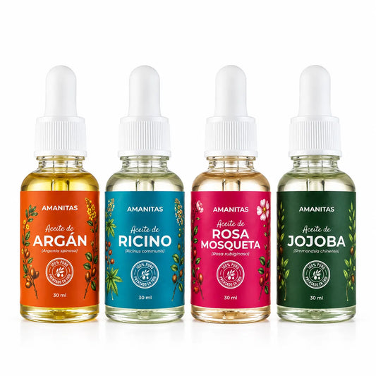 Fotografía de producto sobre fondo blanco de los 4 frascos de vidrio con gotero de 30 ml: Argán, Ricino, Rosa Mosqueta y Jojoba Amanitas.